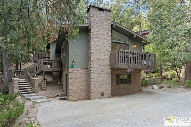 view of side of home featuring a deck