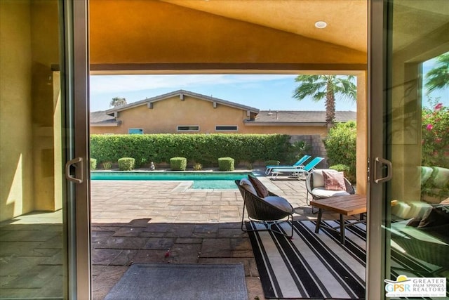 view of swimming pool featuring a patio area