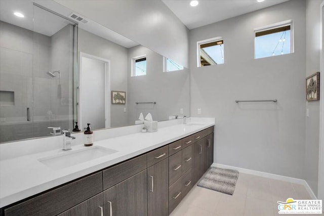 bathroom with vanity and an enclosed shower