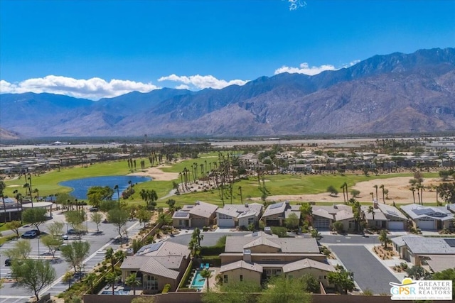 birds eye view of property with a mountain view