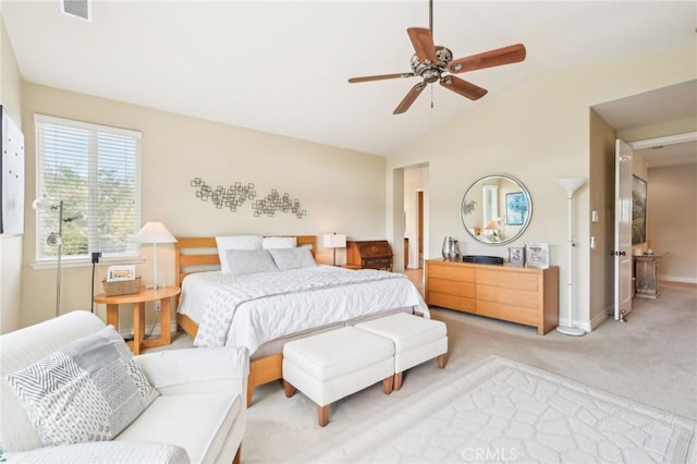 bedroom with light colored carpet, ceiling fan, and lofted ceiling