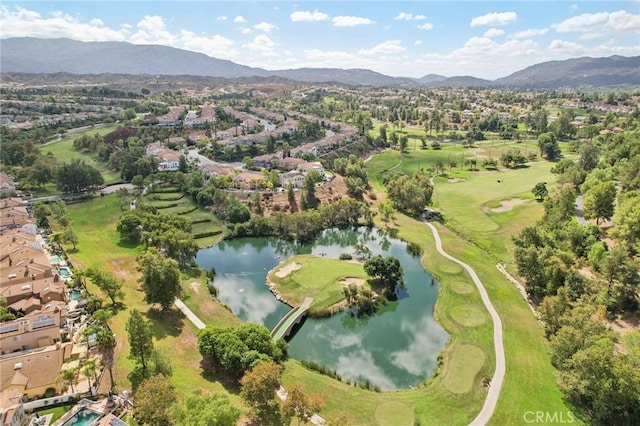 drone / aerial view featuring a water and mountain view