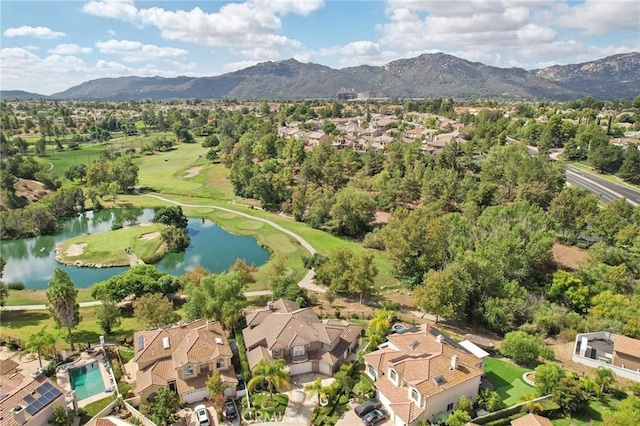 drone / aerial view featuring a water and mountain view