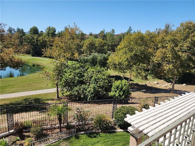 surrounding community with a lawn and a water view