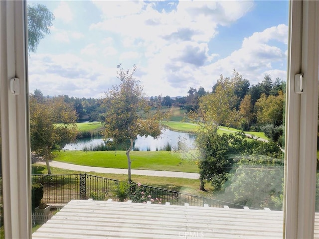 exterior space featuring a yard and a water view