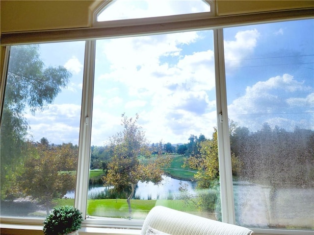 doorway to outside with a water view