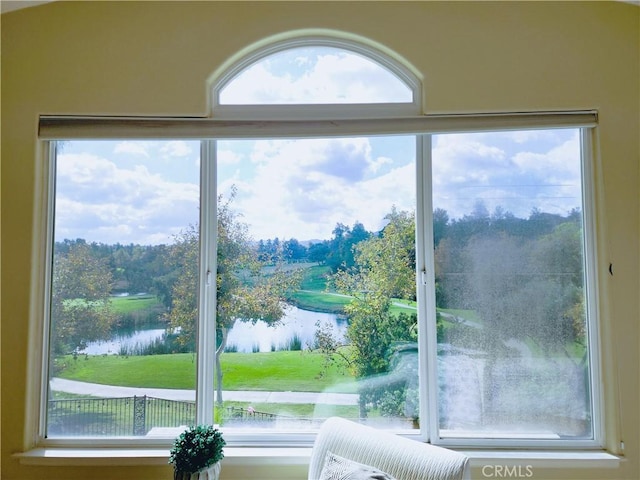 doorway to outside with a water view