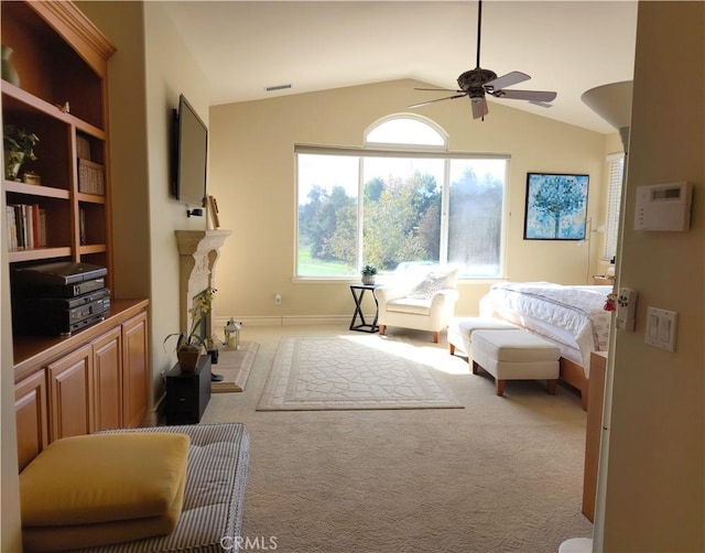 interior space with carpet floors, ceiling fan, and lofted ceiling