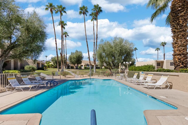 view of swimming pool featuring a patio area