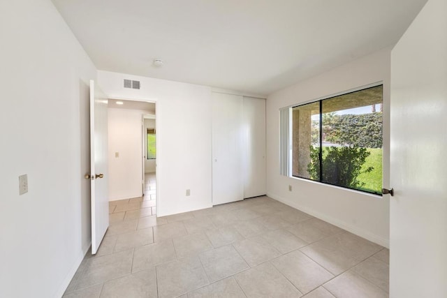 view of tiled spare room