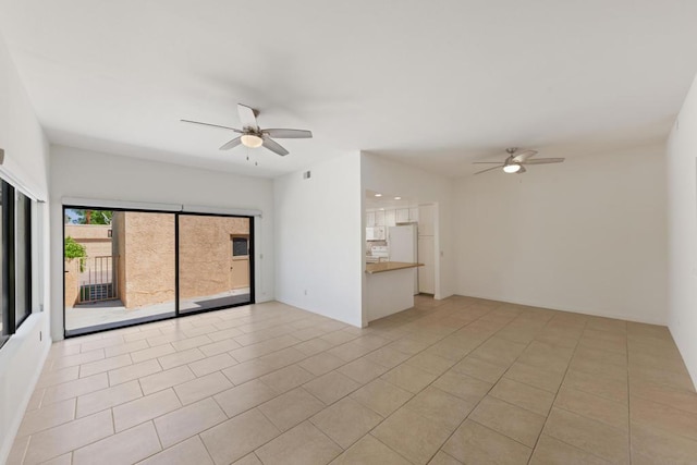 interior space with ceiling fan