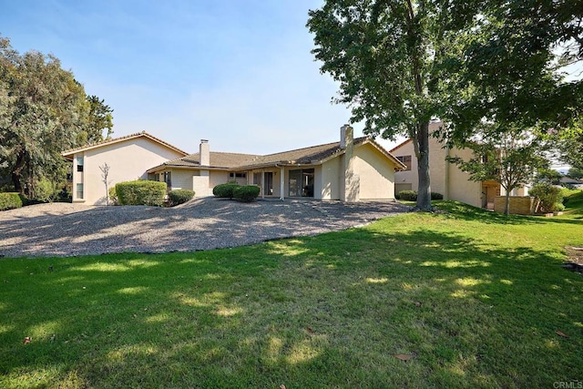 single story home featuring a patio area and a front yard