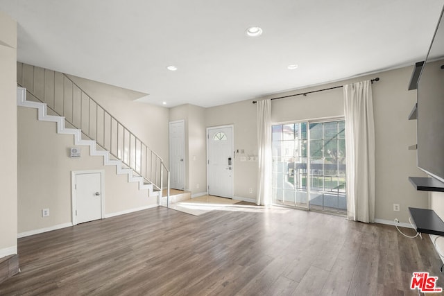 foyer entrance with wood-type flooring