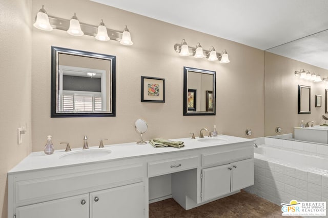 bathroom featuring vanity, tiled bath, and tile patterned floors