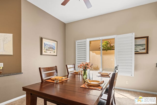 dining area with light tile patterned flooring and ceiling fan