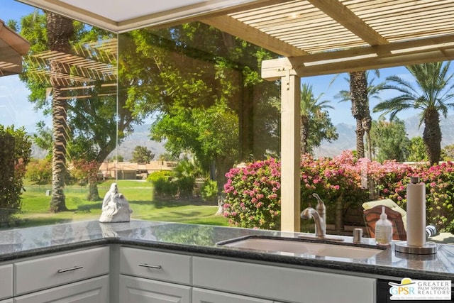 exterior space featuring a pergola and sink