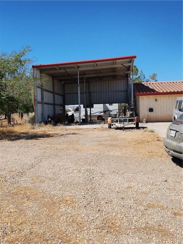 view of outbuilding featuring a carport