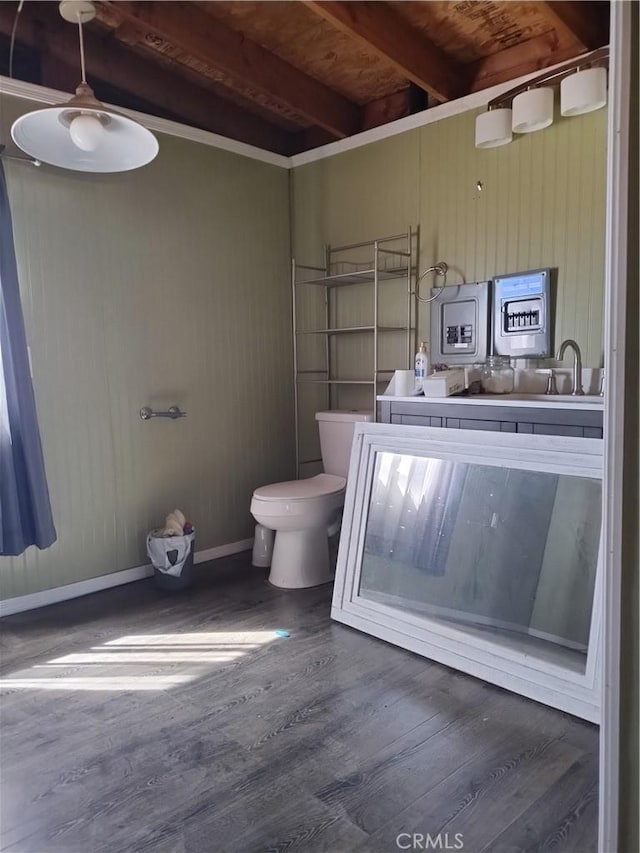 bathroom featuring wood walls, hardwood / wood-style flooring, toilet, beamed ceiling, and wood ceiling