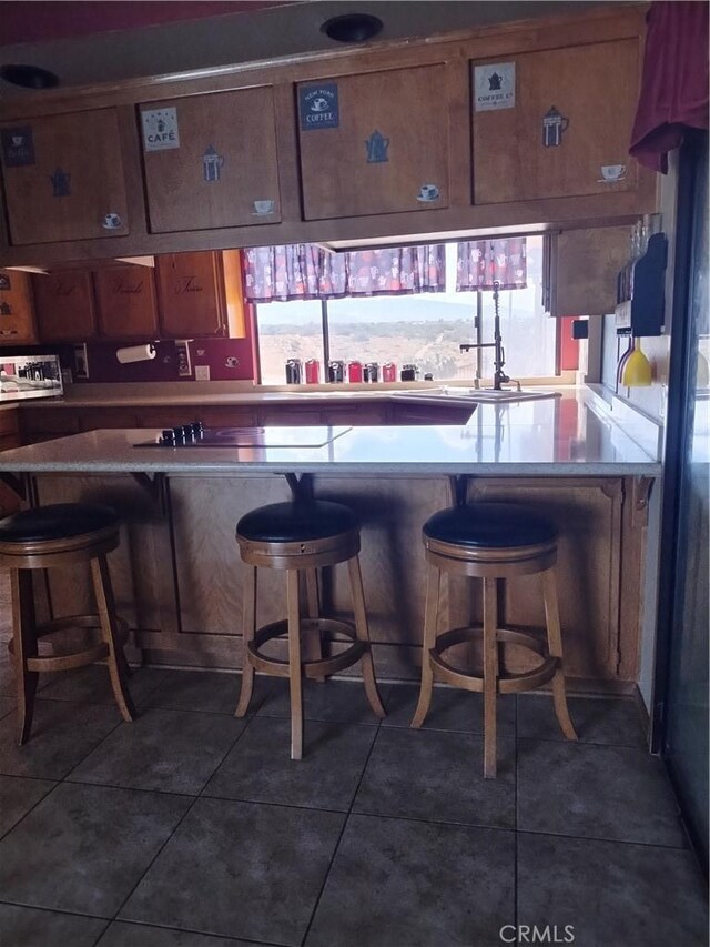 bar with dark tile patterned flooring