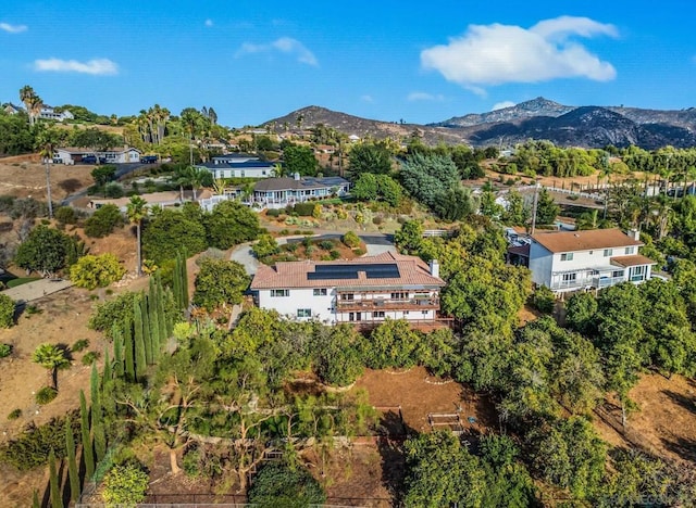 birds eye view of property with a mountain view