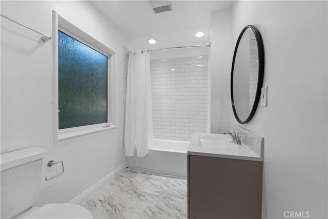 full bathroom featuring shower / bath combination with curtain, vanity, and toilet