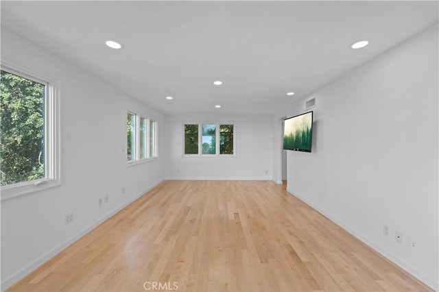 empty room featuring recessed lighting and light wood finished floors