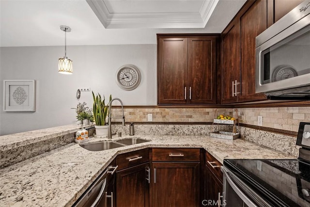 kitchen with electric stove, sink, dark brown cabinetry, ornamental molding, and light stone countertops