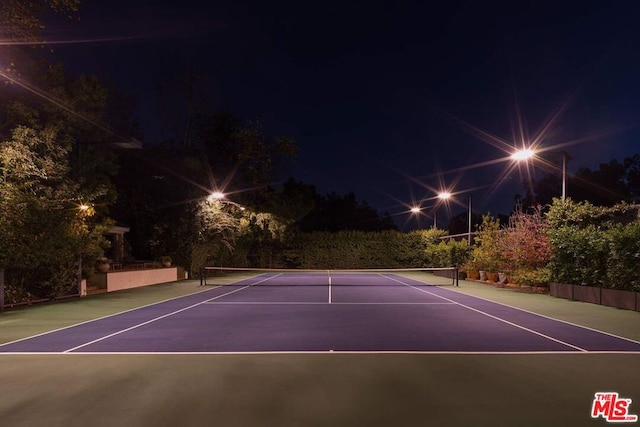 view of tennis court featuring basketball court