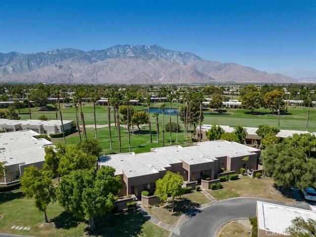 birds eye view of property with a mountain view