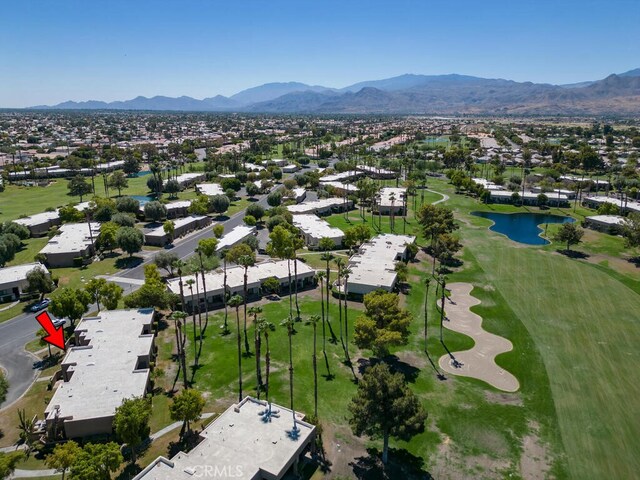 birds eye view of property featuring a water and mountain view