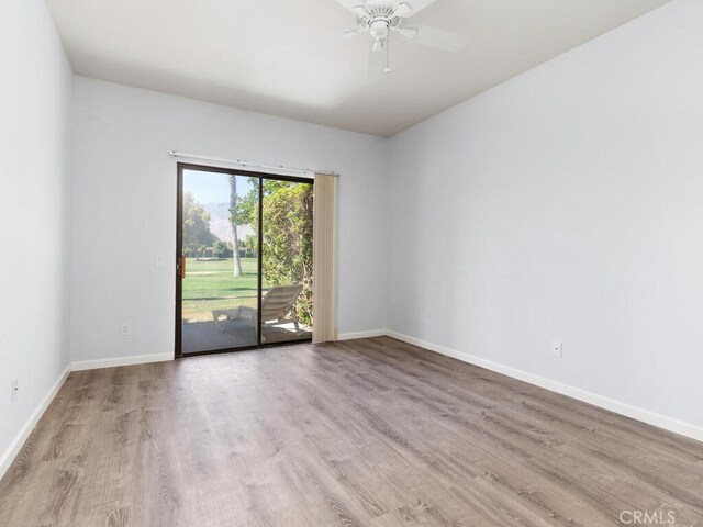 unfurnished room featuring light hardwood / wood-style floors and ceiling fan