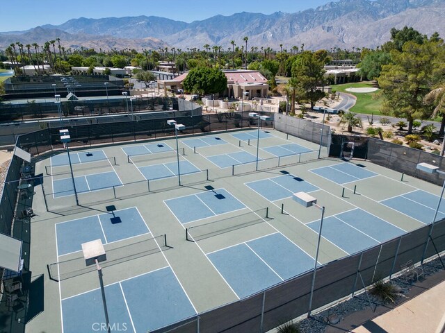 view of tennis court with a mountain view