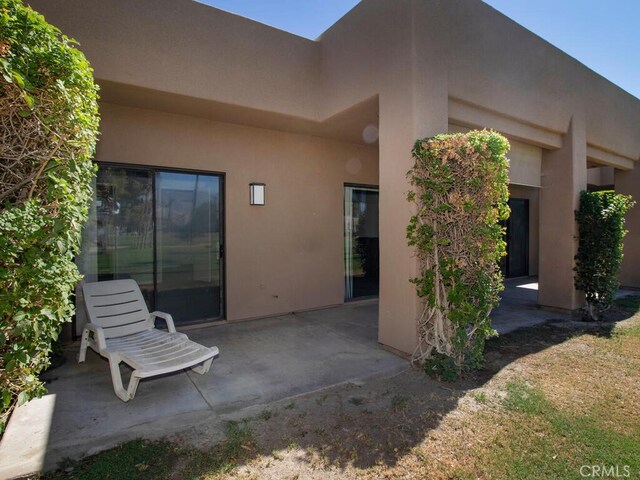 back of house with a patio area