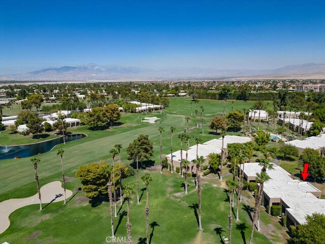 birds eye view of property with a water and mountain view