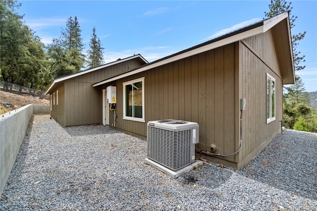 back of house featuring central AC