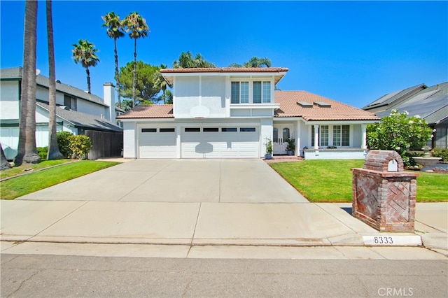 mediterranean / spanish house featuring a front lawn