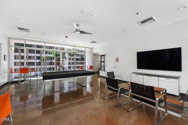 rec room featuring ceiling fan, expansive windows, and billiards