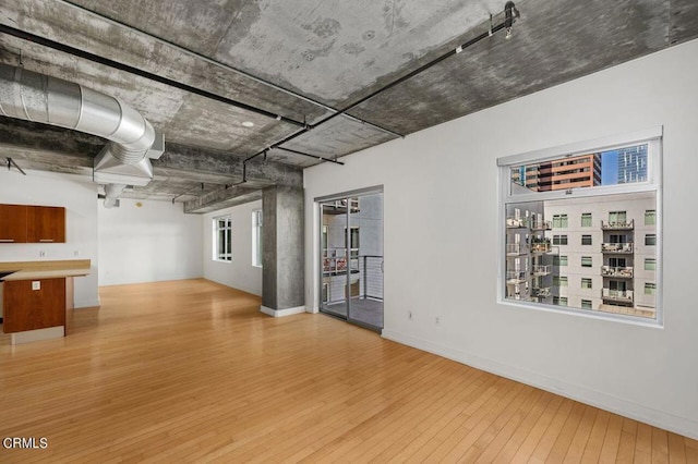 unfurnished living room featuring hardwood / wood-style floors