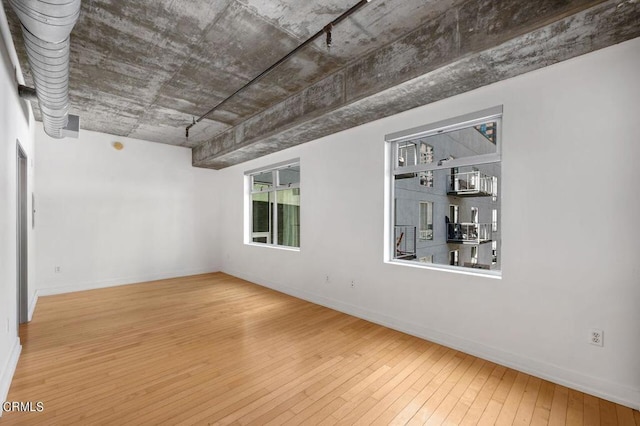 empty room with wood-type flooring