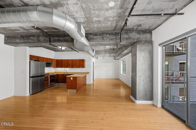 kitchen featuring light hardwood / wood-style flooring, stainless steel appliances, and sink