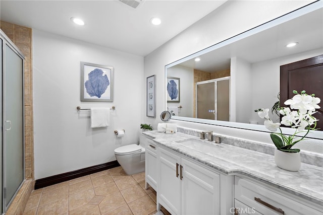 bathroom featuring tile patterned flooring, vanity, toilet, and a shower with door