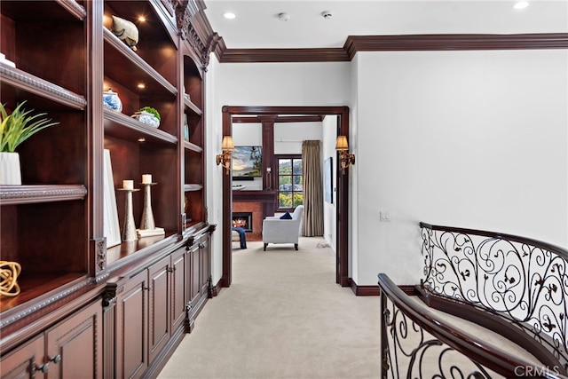 hallway featuring light carpet and ornamental molding