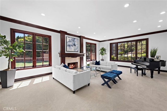 living room with ornamental molding, light carpet, and a premium fireplace