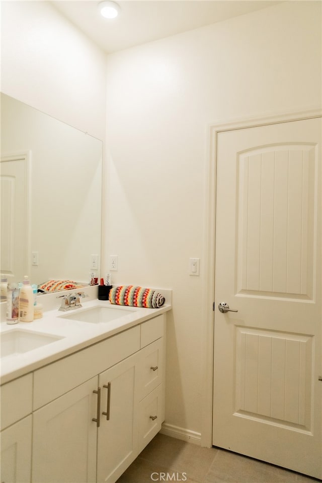 bathroom featuring vanity and tile patterned flooring