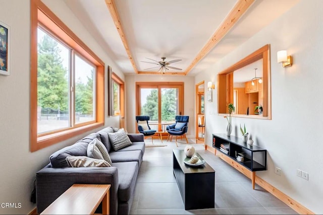 tiled living area with a ceiling fan