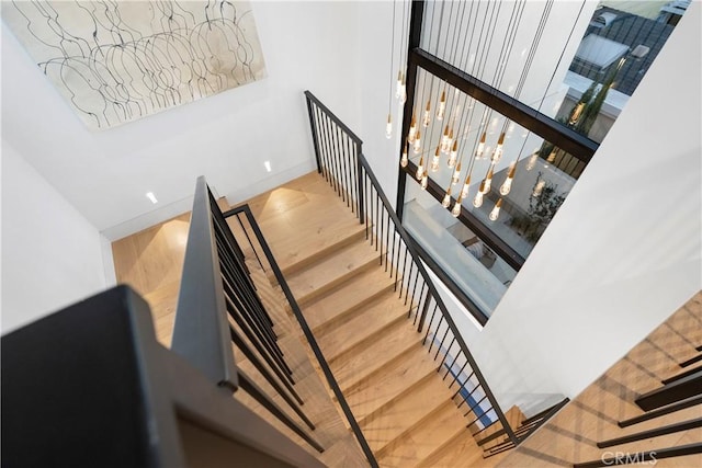 staircase with wood finished floors