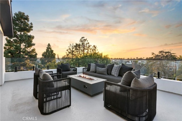 view of patio / terrace with an outdoor living space with a fire pit