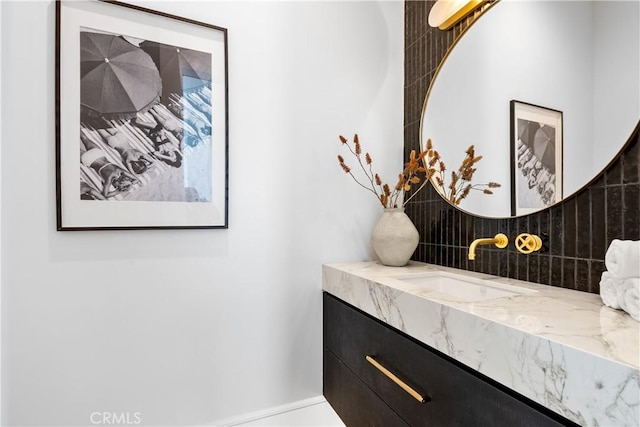 bathroom featuring backsplash and vanity