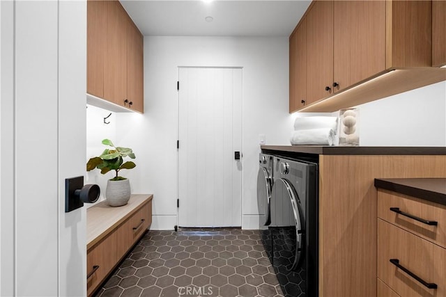 laundry room with cabinet space and washing machine and clothes dryer