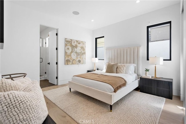 bedroom featuring light wood-style flooring and recessed lighting